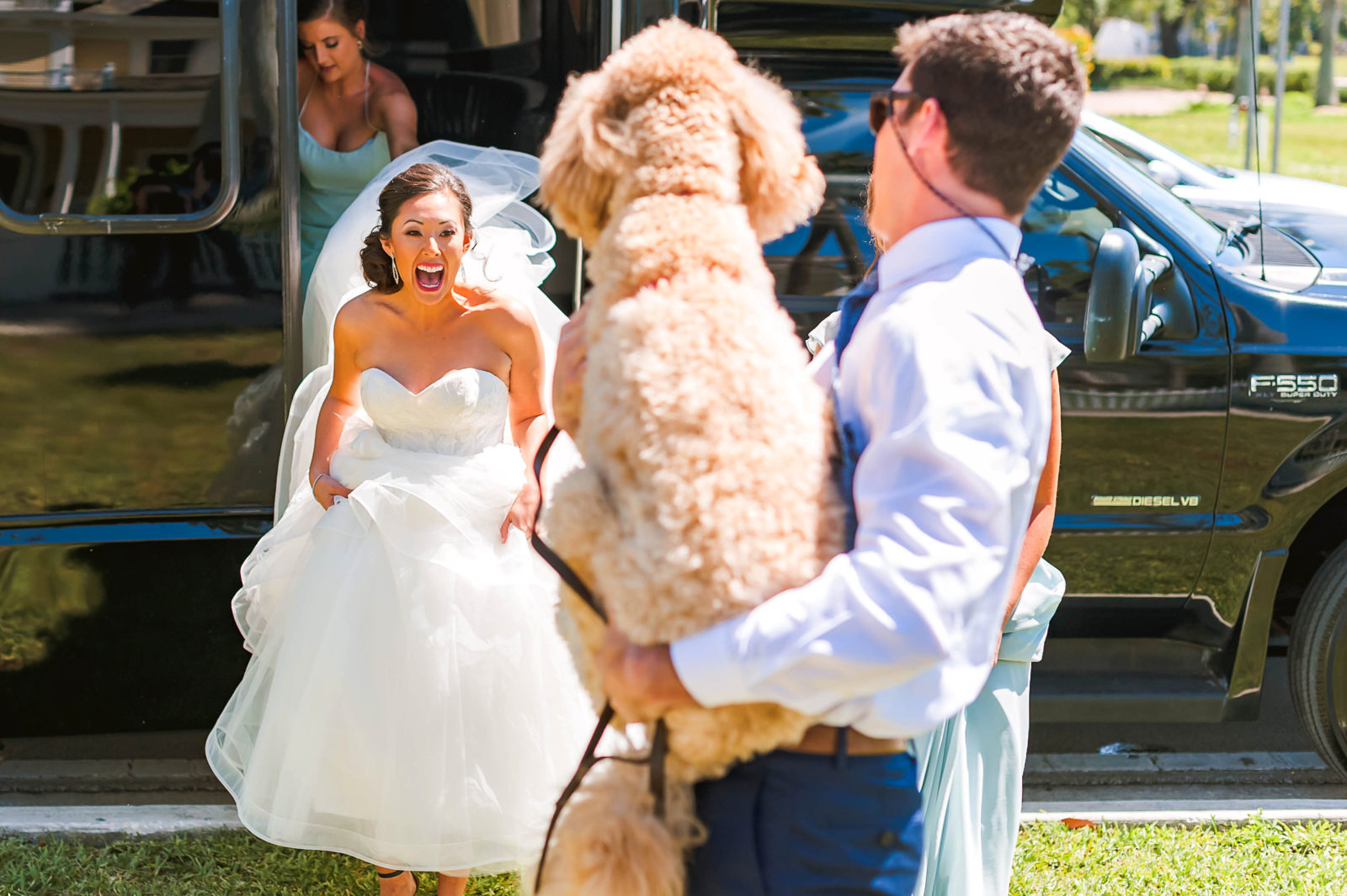 bride seeing her dog| erin schmidt photo | burroughs home wedding fort myers florida wedding photos | Fort Myers Florida wedding