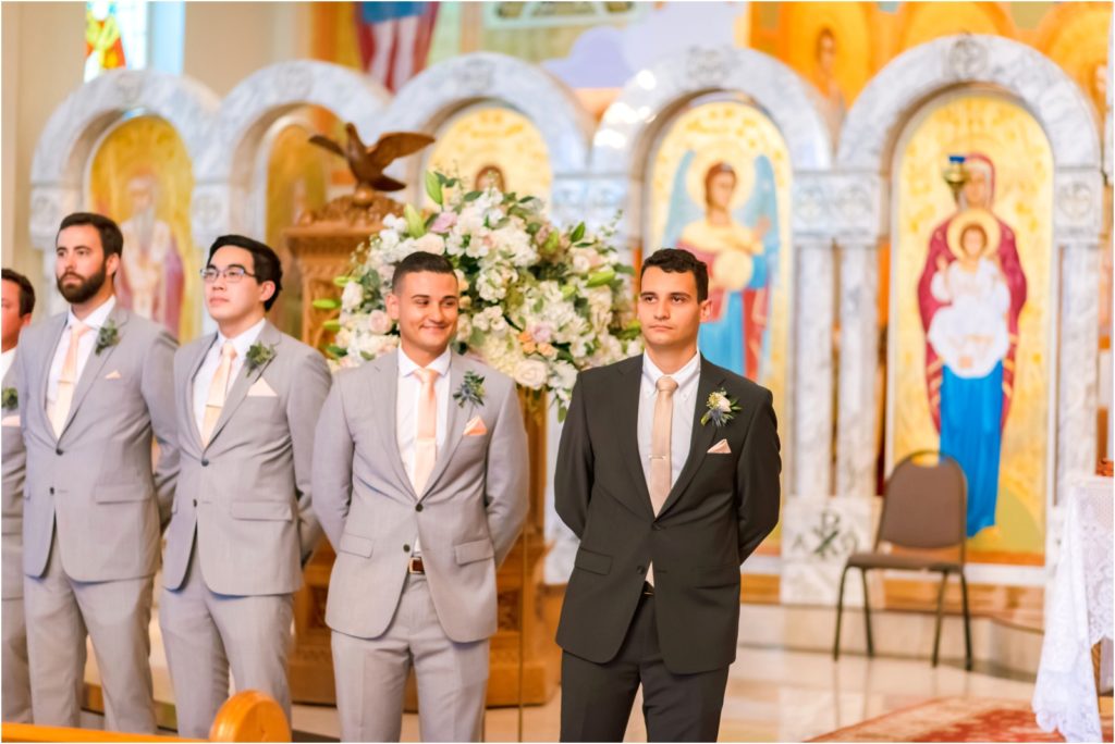 A groom watching has his bride comes down the aisle in a Marthoma church ceremony
